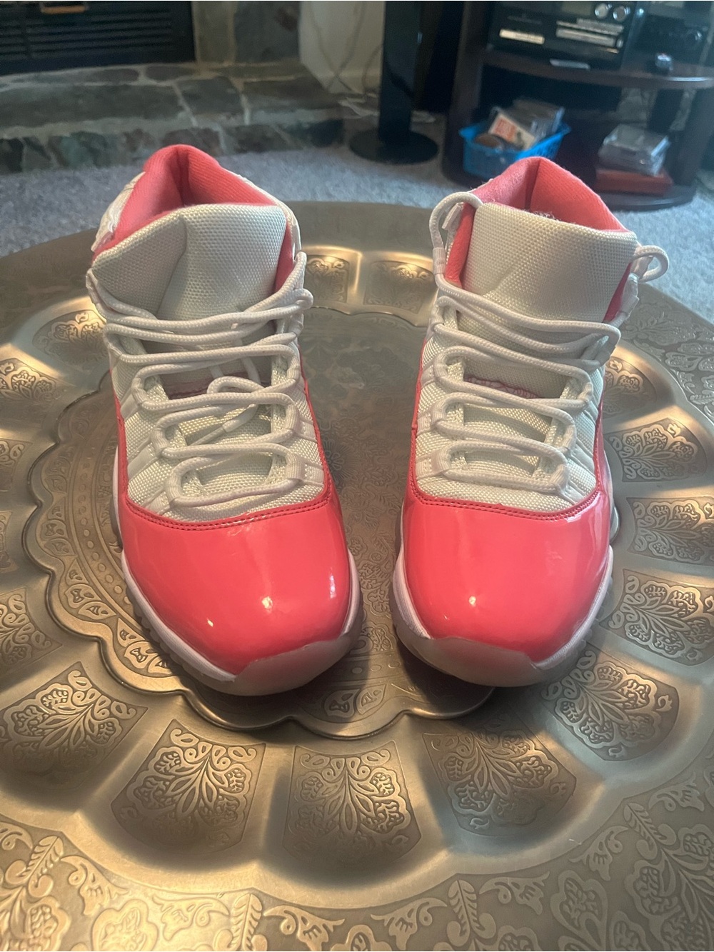 Women’s pink and white Air Jordan 11 sneakers